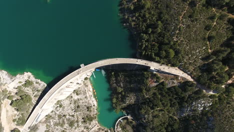 Aerial-vertical-drone-view-over-a-dam-in-south-of-France.-Artificial-lake-hydro